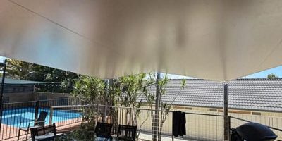 Example of waterproof shade sail with proper fall to prevent water pooling