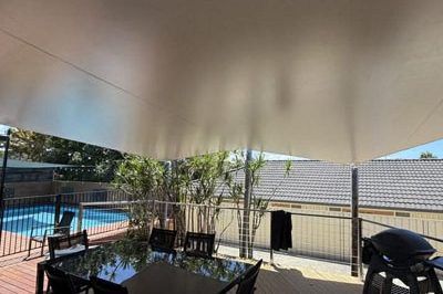 Example of waterproof shade sail with proper fall to prevent water pooling