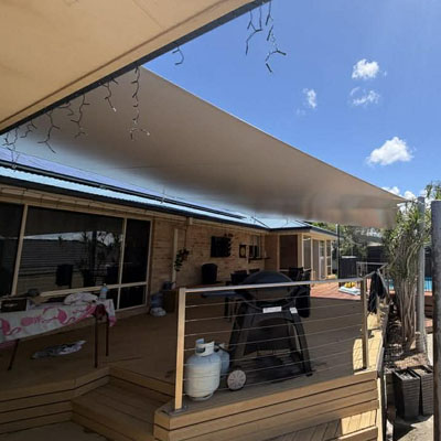 Waterproof PVC shade sail over outdoor dining area